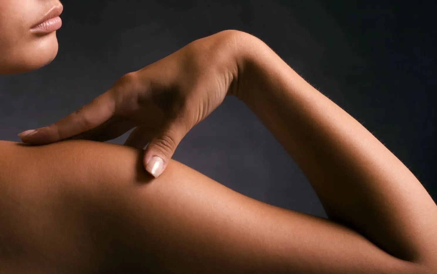 A woman with a beautiful spray tan from Pop N Glow